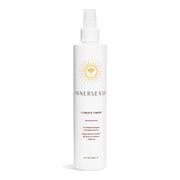 White Innersense I Create Finish hairspray bottle with orange sun logo and pink accent line.