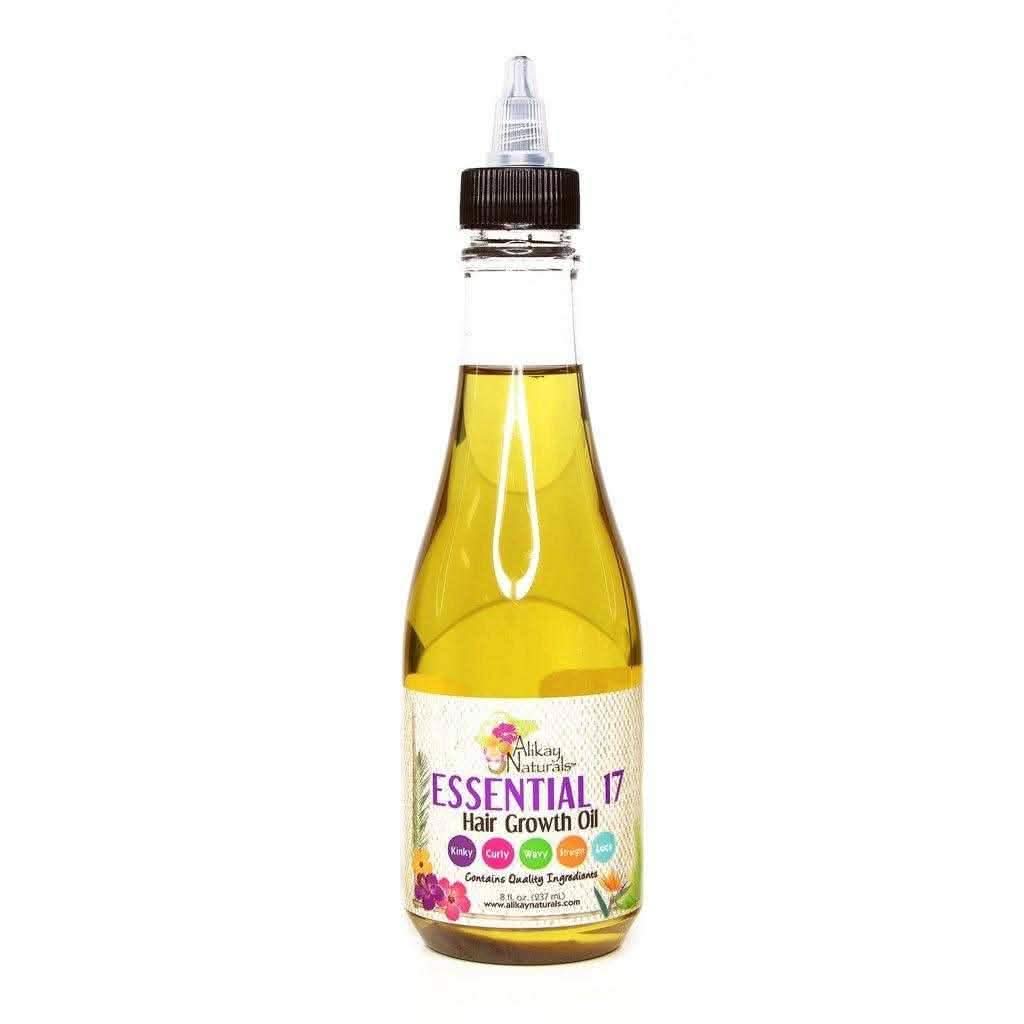 Alikay Naturals Essential 17 Hair Growth Oil 237ml in a clear bottle with a pointed applicator.