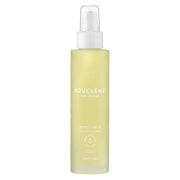 Bouclème Revive 5 Hair Oil 100ml in a clear bottle with a white pump, yellow liquid visible.