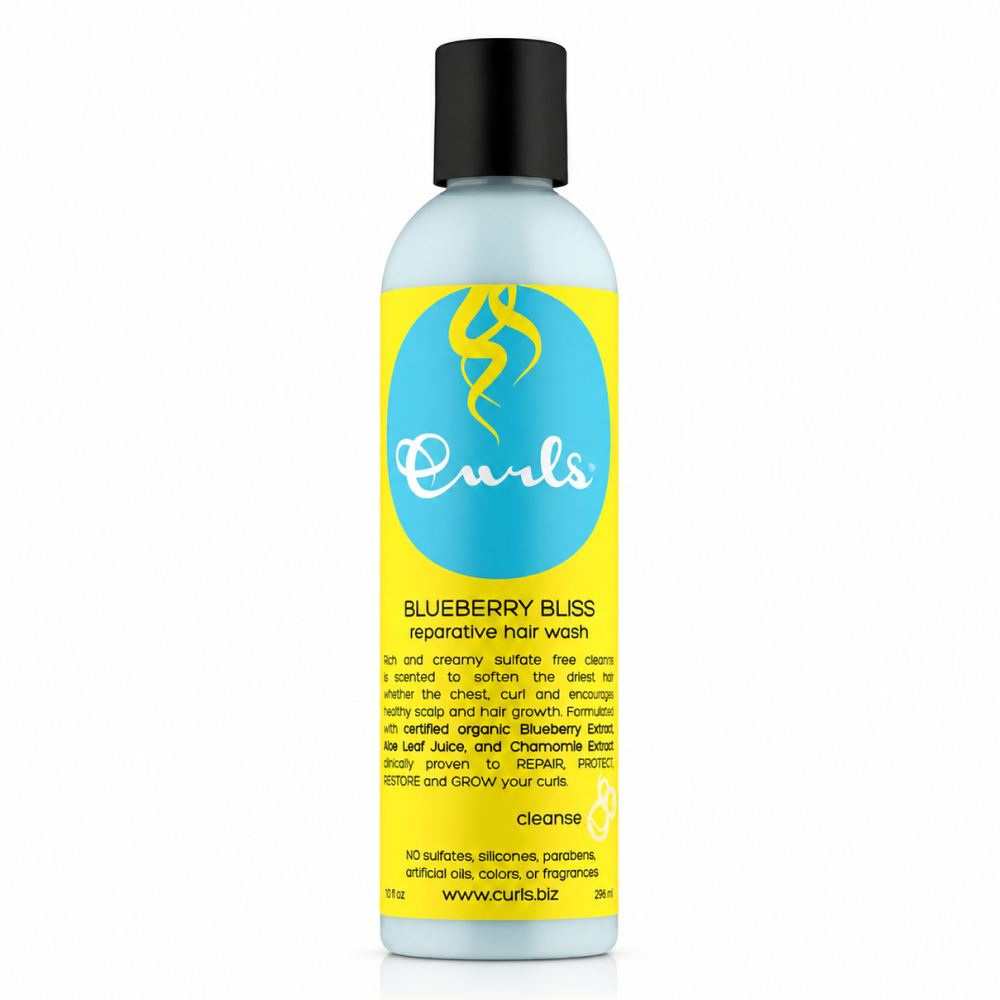 Light blue Curls Blueberry Bliss Reparative Hair Wash bottle with black cap and yellow/blue label.