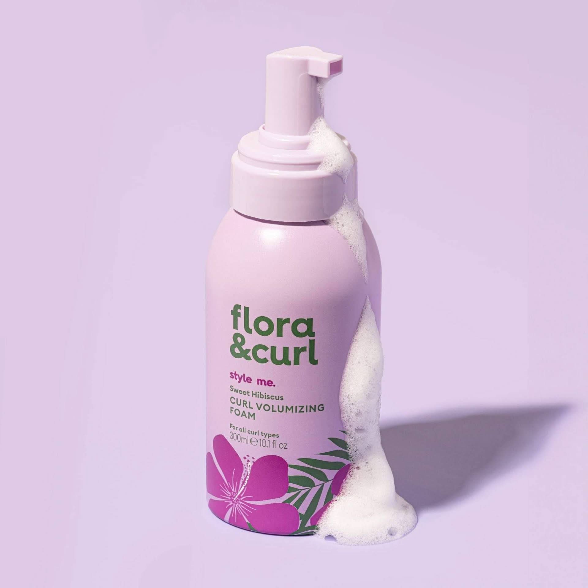 Flora & Curl Sweet Hibiscus Curl Volumizing Foam, 300ml, in a pink bottle with foam spilling out.