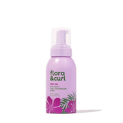 Flora & Curl Style Me Sweet Hibiscus Curl Volumizing Foam, 300ml, in a lavender bottle with hibiscus flowers.