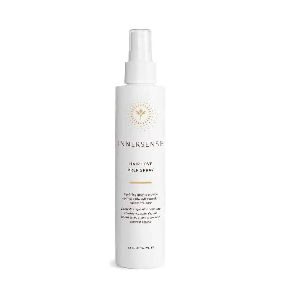 White Innersense Hair Love Prep Spray bottle with gold sunburst logo and black text.