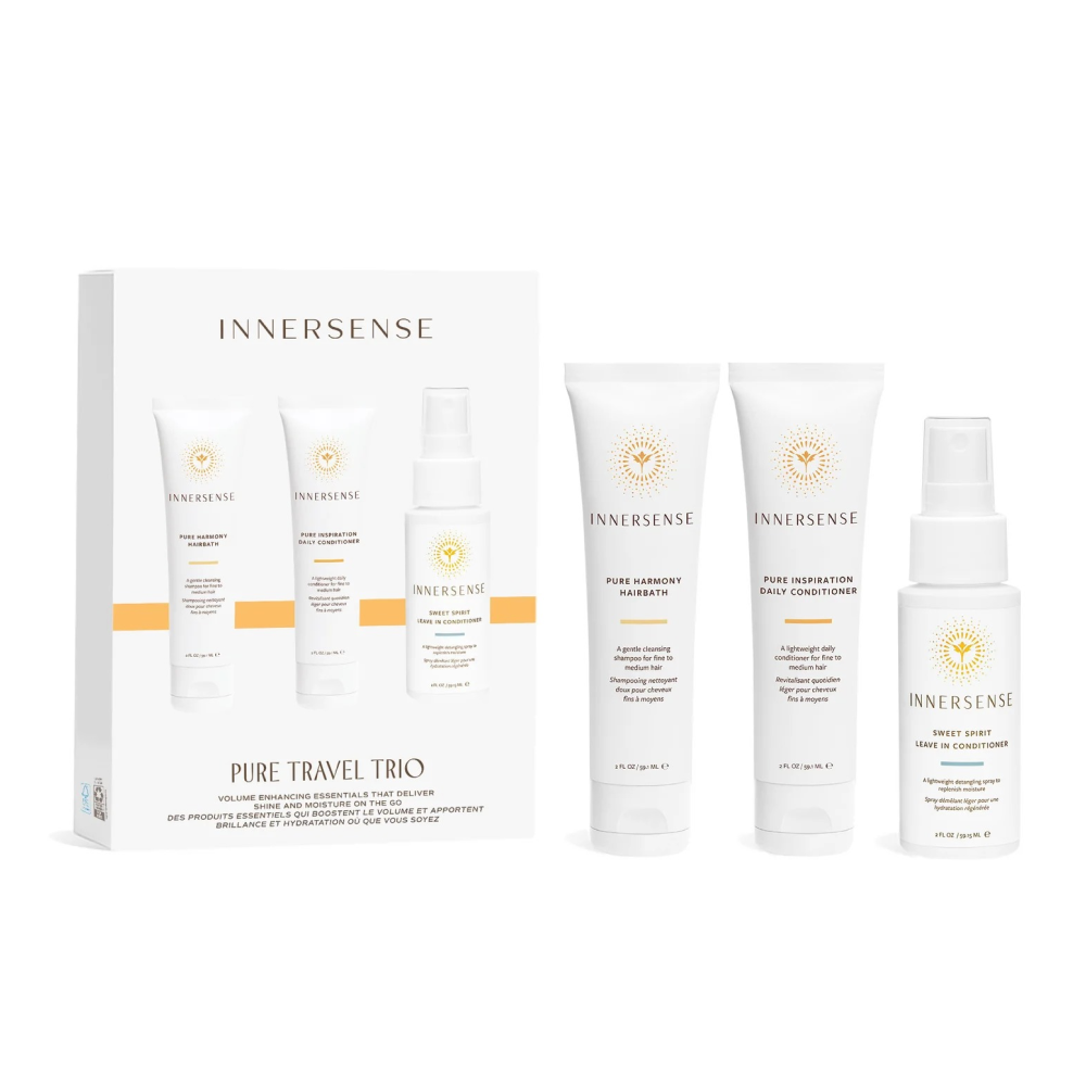 White Innersense Pure Travel Trio box with three small white bottles: shampoo, conditioner, and leave-in spray.
